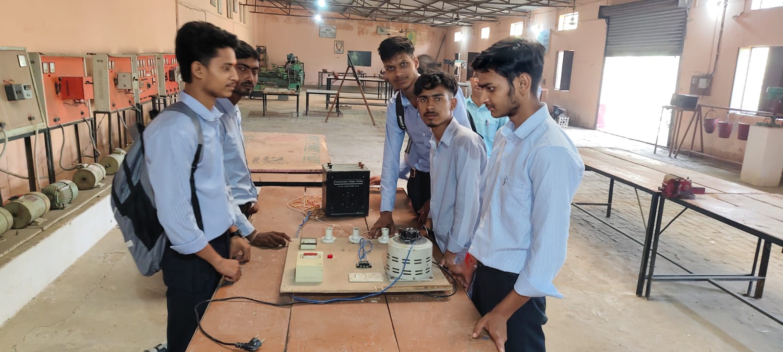 Practical class &mdash; trainees wiring a transformer test board in the electrical workshop